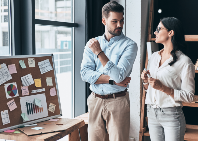 Two colleagues discussing a digital marketing strategy for restaurants.